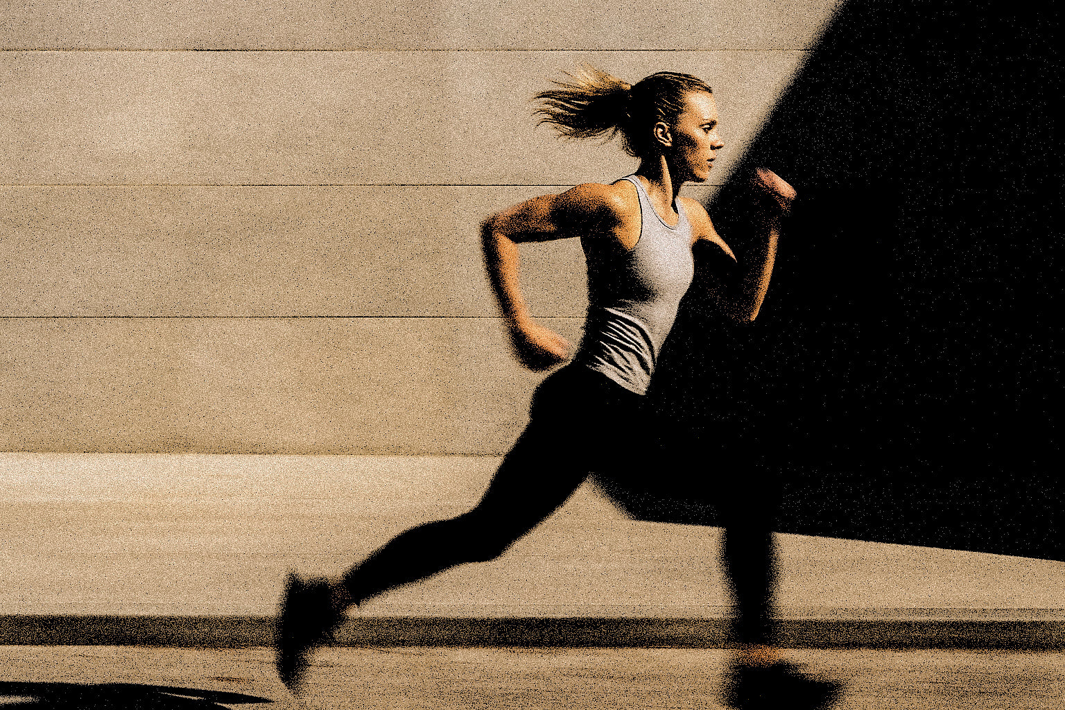 Woman running outdoors with a blurred background